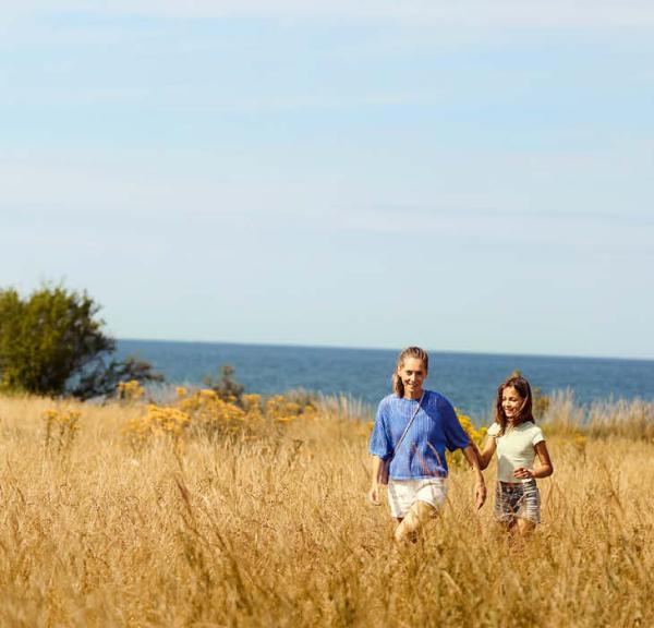 Two people in a field at Center Parcs Nordborg Resort.